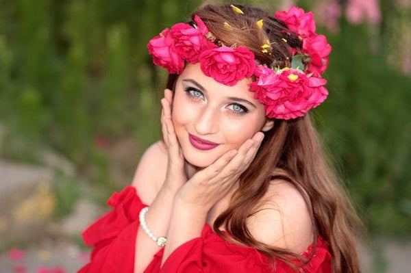 girl wearing a red dress and a flower crown