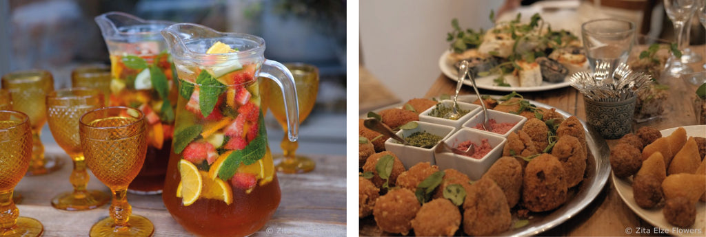 jar with sangria and finger food