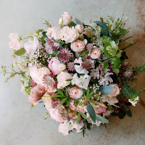 Mixed pink flowers bouquet with pale pink roses