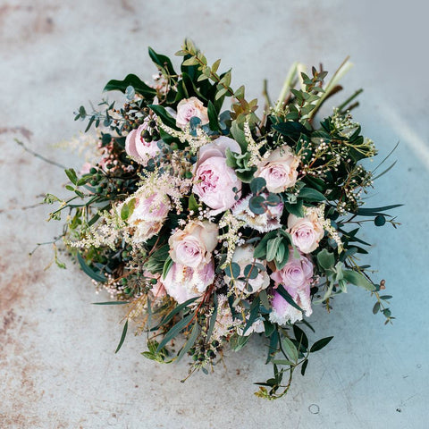 pale pink roses and green leaves flower bouquet
