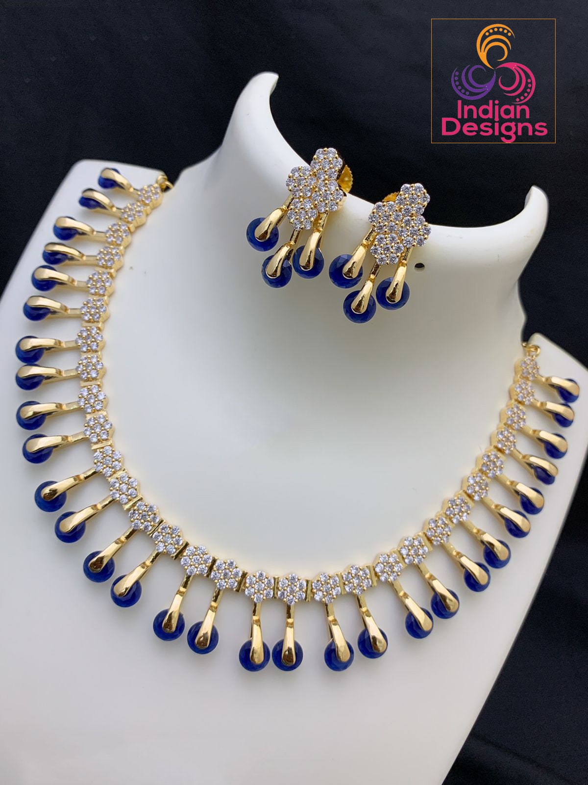 Buy Gold Toned And Blue Stone-Studded Jewellery Set Online - KARMAPLACE —  Karmaplace