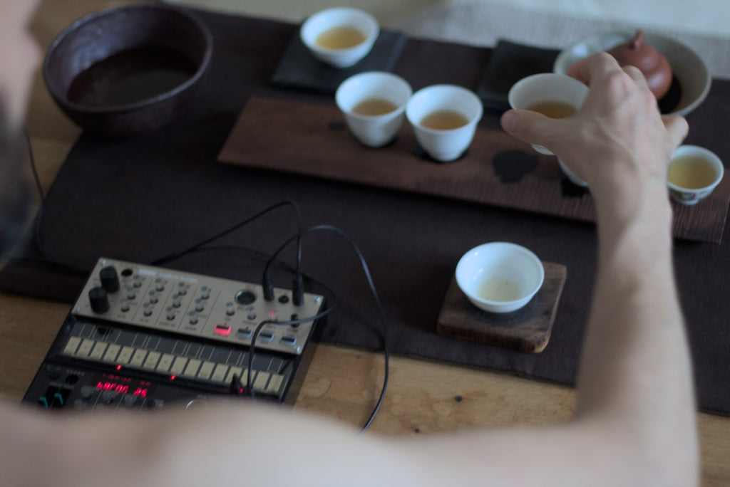 man drinking oolong tea and make electronic music