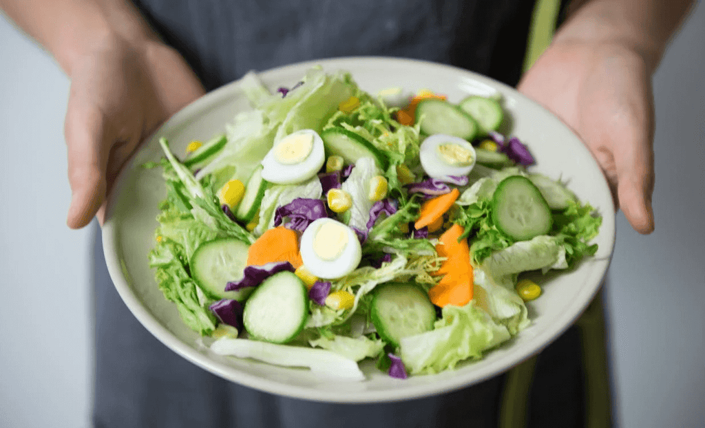 Salad with lettuce, cucumbers, carrots, and other veggies
