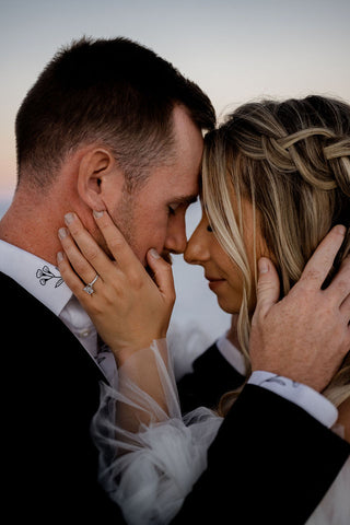 couples holding each others faces at the salt flats