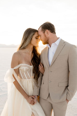 woman and man holding hands and touching foreheads