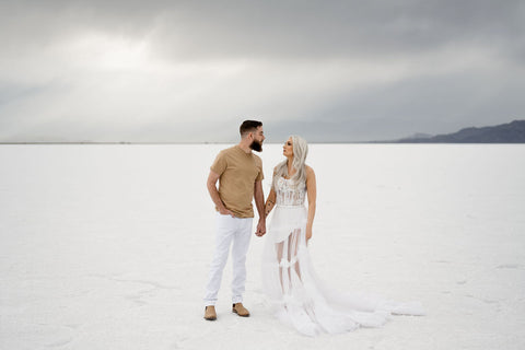 couple at the salt flats, stormy sky, white dress