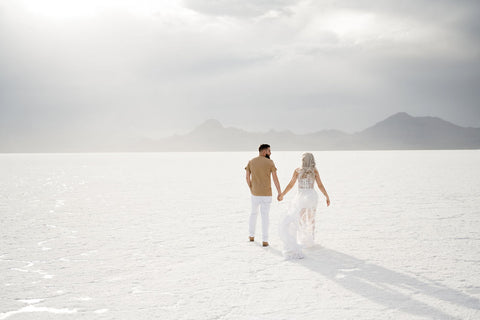 couple at the salt flats, woman in white lace dress