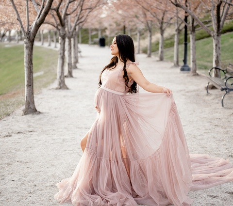 Maternity photo, pink gown, cherry blossoms