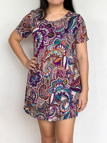 image of person wearing paisley dress