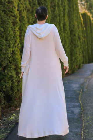 image of woman wearing a dress and cardigan