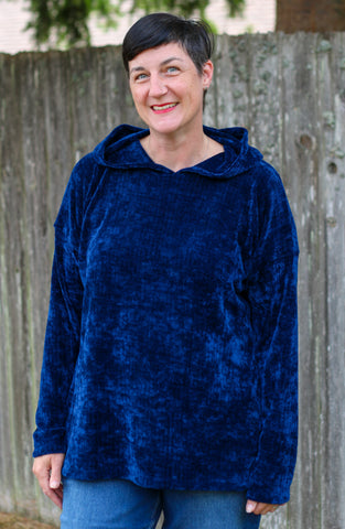 image of woman wearing blue hoodie
