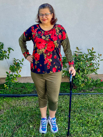 image of a woman wearing red floral top