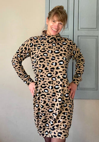 image of person wearing cheetah print dress