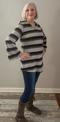 image of person wearing a stripe hoodie