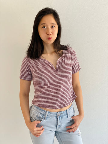 image of person wearing a stripe crop henley