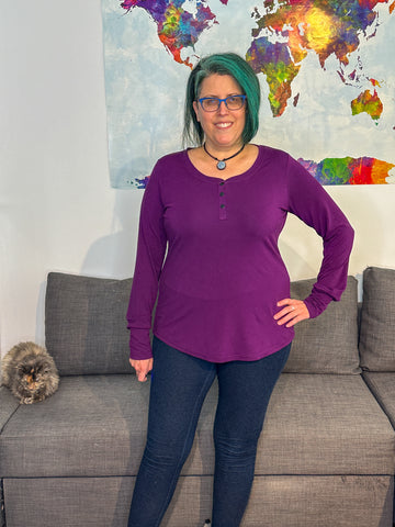 image of person wearing a purple top