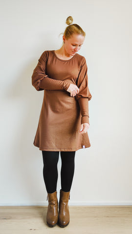 image of person wearing brown dress