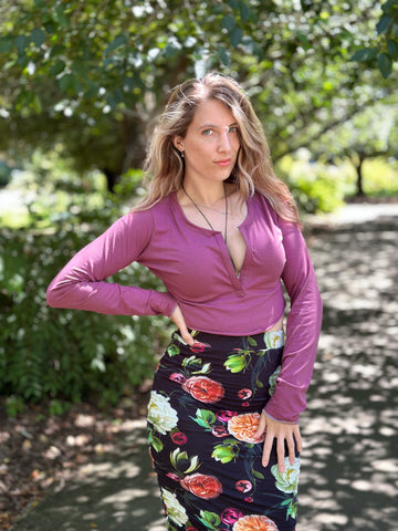 image of person wearing a purple crop top