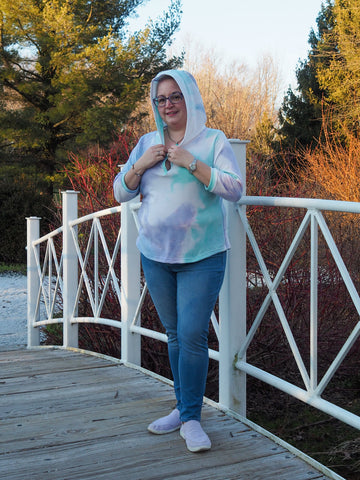 image of a person wearing a white hoodie