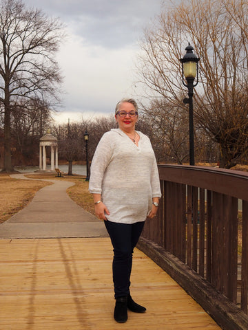 image of a person wearing a white hoodie