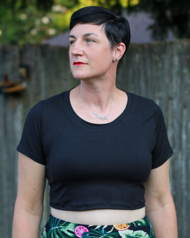 image of a woman wearing a black crop top