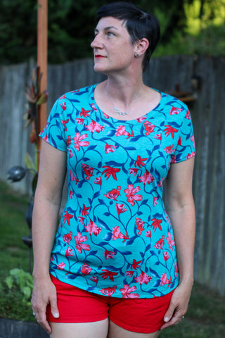 image of a woman wearing a blue floral tshirt