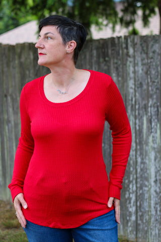 image of a woman wearing a red top