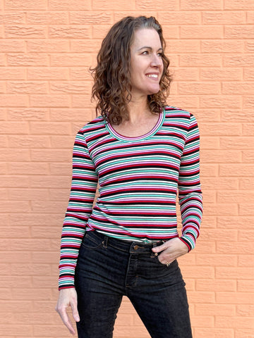 image of a person wearing a striped top and black pants