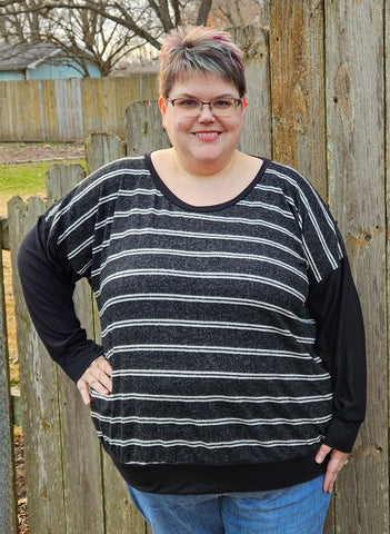 image of a woman wearing a black and white stripe top