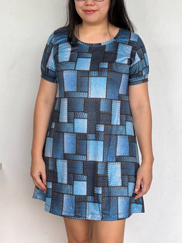 image of person wearing printed blue dress