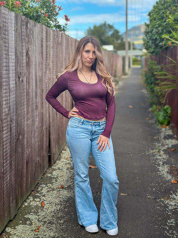 image of woman wearing a purple top