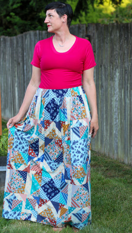 image of a woman wearing a pink tshirt and patchwork skirt