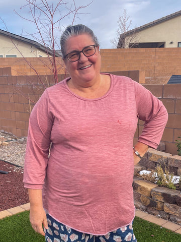 image of a person wearing a pink top