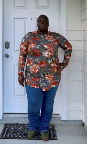image of a person wearing a long sleeve floral top