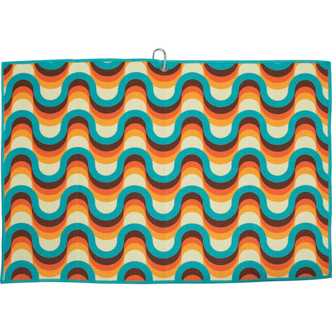 Colorful golf towel with a retro wave pattern in shades of turquoise, orange and brown, complete with a hanging loop in the upper right corner, against a neutral background.