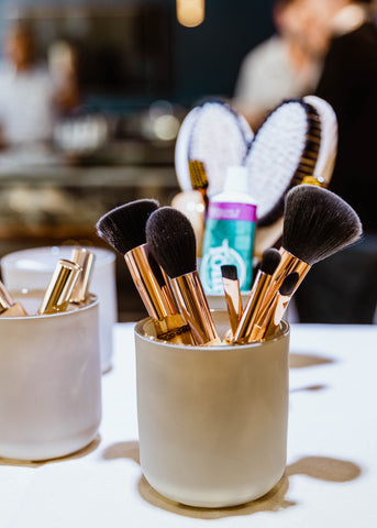 Repurposing our candle glass to house makeup brushes