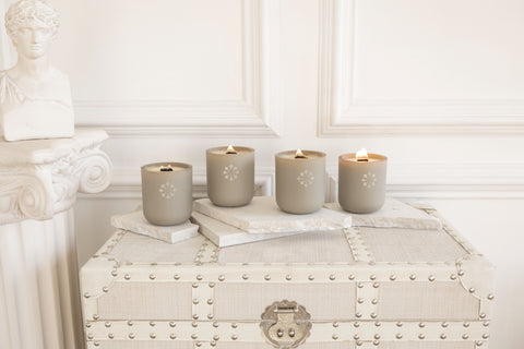 four truffles candles lit on a trunk case