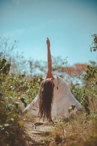 woman doing yoga in the forest