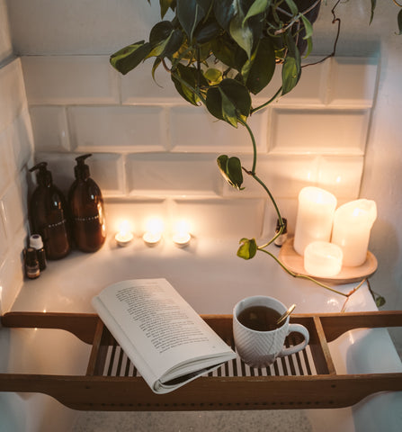 Bath with Candles and Book on Tray for Relaxation
