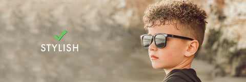 a kid wearing a eyewear looking in a stylish mood