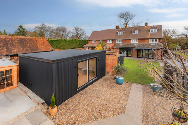 black slatted cladding installed by myouthouse.co.uk