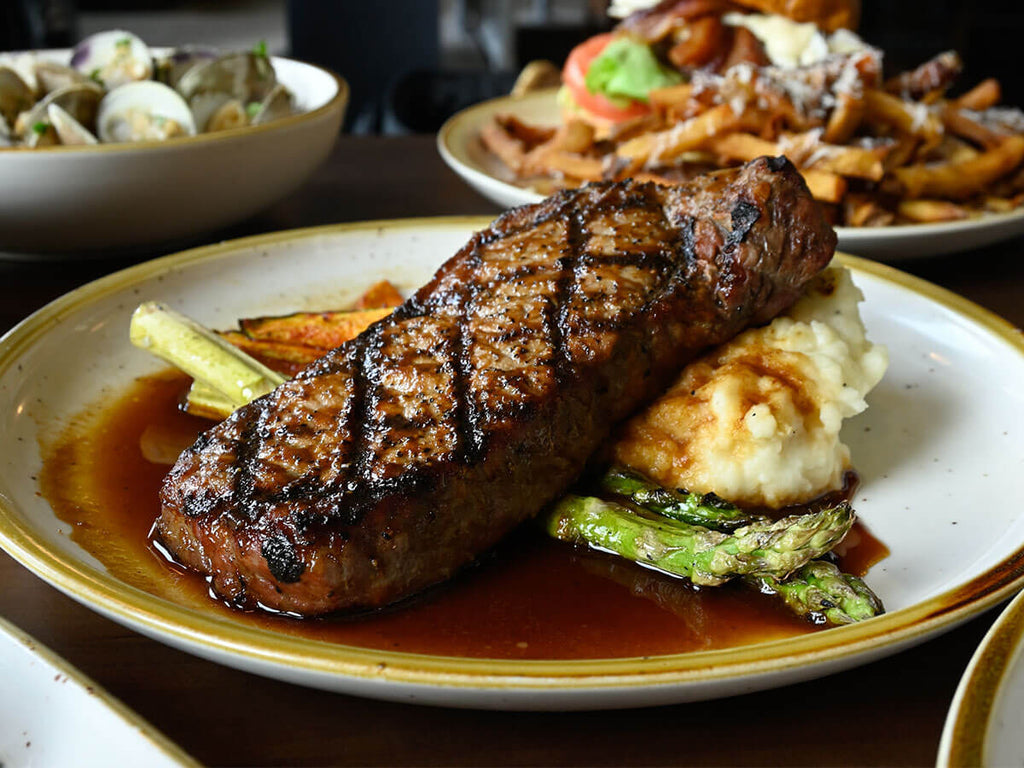A close-up of a Kansas City Strip Steak
