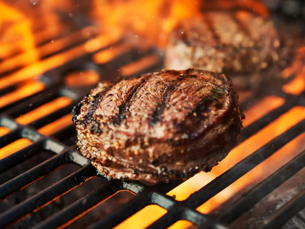 Grilled Filet Mignon steak with spices and herbs