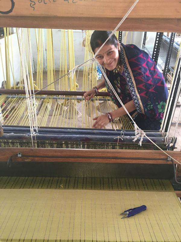 setting up hand loom for ethically made resort wear