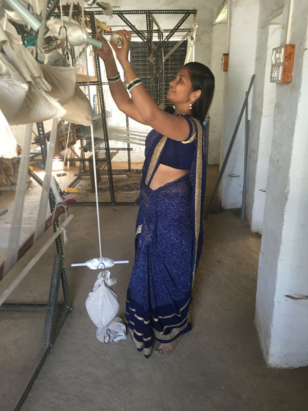 setting up hand loom for ethically made resort wear