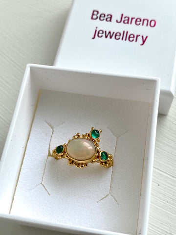 commissioned ring recycled 24ct yellow gold vermeil Ethiopian opal and emerald gemstones