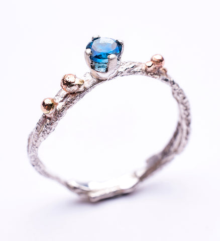 Bea Jareno Jewellery tierra collection ring recycled sterling silver and yellow gold granule details with a London blue topaz gemstone