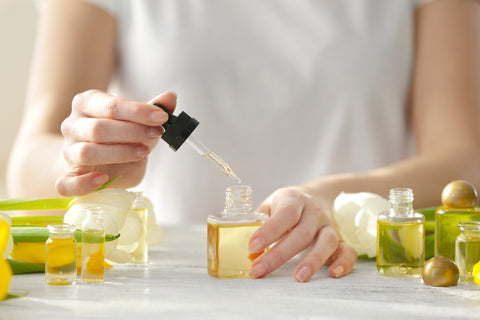 Inserting scented body oils into bottles