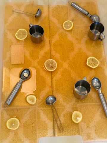 Water sensory play with citrus added 