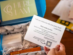 Someone receiving a subscription box with DIY stress relief products